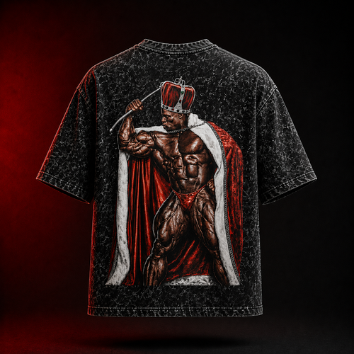 A black acid-wash graphic t-shirt shown from the back, featuring a large print of a muscular bodybuilder wearing a red crown and a red and white cape.